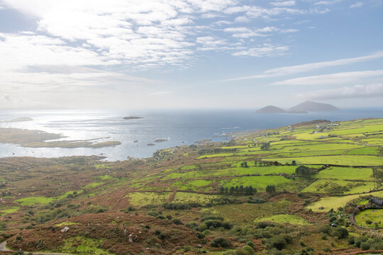 Panoramic high level view over the coastline of Kerry County, Ireland and the North Atlantic Ocean with in distance Scariff and Deenish islands