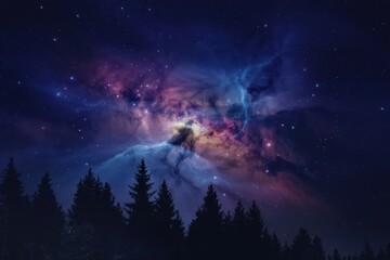 Stunning vibrant cosmic nebula and stars over dark silhouette of pine forest