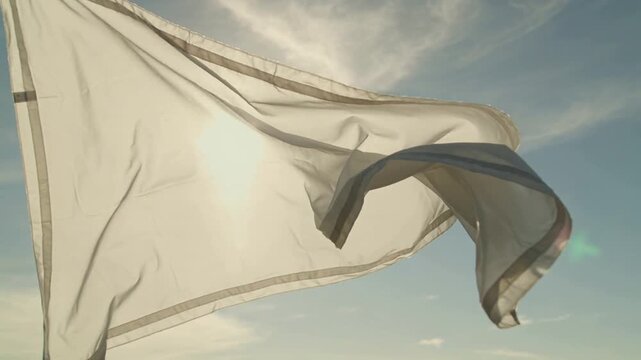 Slow motion of white fabric floating in sunlight &mdash; ethereal dream aesthetic