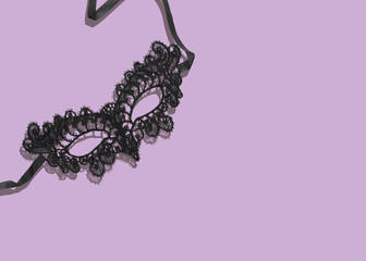 Black Lace Mask For Carnival Or Mardi Gras Celebration on Pastel Purple Background. Concept Of Masquerade Ball Fashion, Mysterious Party Looks, Festive Accessories, Theatrical Costume Styling