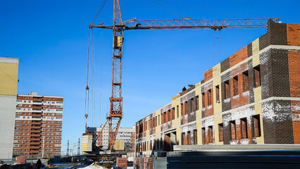 Construction site of an apartment building in winter.