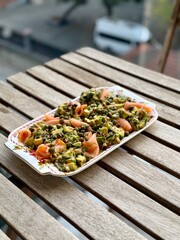 Salad with smoked salmon, avocado, and green leaves. Ideal healthy lunch or dinner concept