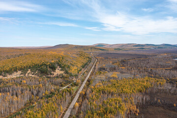 Aerial photography of the autumn forest railway in the Greater Khingan Range