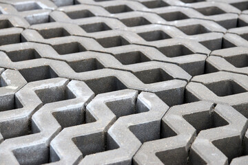 Checkered Concrete Cinder Tiles Of A Garden Sidewalk Lawn In Palette. Turf Grass Block Paving Stones. Grasscrete is eco friendly material for driveways, parking lots or garages instead of concrete