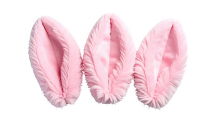 Three fluffy, pink bunny ears sit isolated against a stark black background