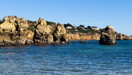 Rocky seashore. View of Praia da Vigia beach in Albufeira, Portugal, Europe