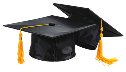 Two black graduation caps are stacked, featuring yellow tassels, against a dark background