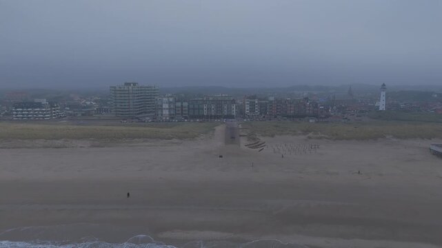 Misty Coastal Skyline of Egmond aan Zee at Dusk
