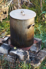 cooking in metal pot outdoor