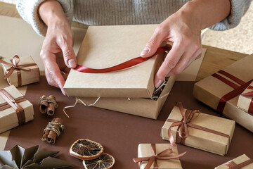 Christmas gift zero waste, eco friendly hand made box packaging gifts in kraft paper wooden table,...