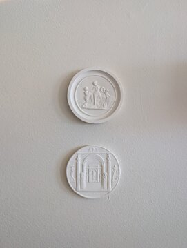 Greek coin on a wall