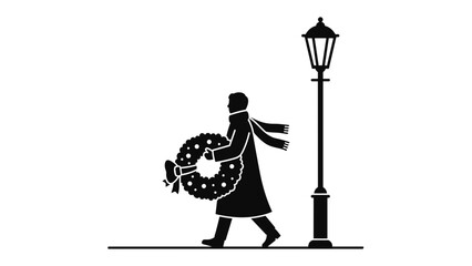 Silhouette of person carrying wreath walking past lamppost