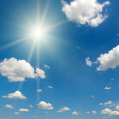 Bright midday sun and beautiful blue sky with clouds.