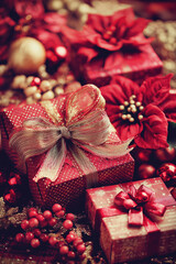 xmas decoration presents and red flowers closeup, golden pearls and beans, bokeh, winter, peacefully, celebrate, merry christmas, christian, x-mas, noel, nativity, holiday, portrait format, photoreali