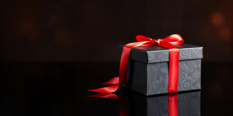 Luxury Gift Box with Red Ribbon on Black Background