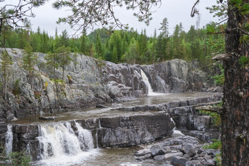 Fototapeta premium Idyllic view of cascasing waterfalls in a Norwegian forest, west of Oslo, Norway
