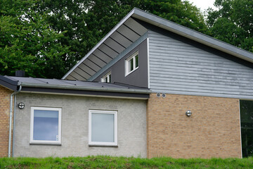 Modern residential house exterior with clean architectural lines and mixed materials