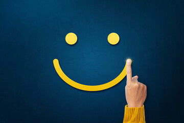 Excellent, positive feedback, service rating and satisfaction. Hand of client show a feedback with smiley face indicates the highest level of satisfaction with the service