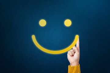 Excellent, positive feedback, service rating and satisfaction. Hand of client show a feedback with smiley face indicates the highest level of satisfaction with the service