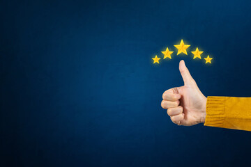 Excellent, positive, feedback, service rating and satisfaction. Man hand showing thumb and giving a five-star rating indicates the highest level of satisfaction with the service