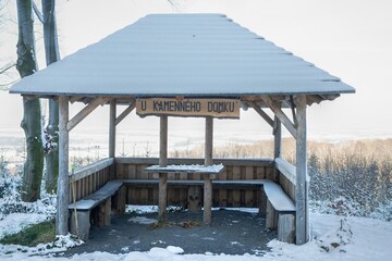 Snow-covered rest shelter for tourists. Hostyn Mountains. Czech Republic.