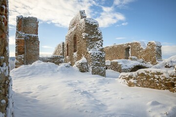 Stary Jicin castle ruins. Remains of the walls in the snowy upper courtyard. Czech Republic.