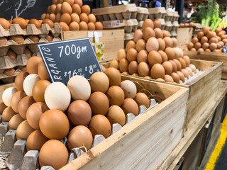 Organic eggs stacked at a market
