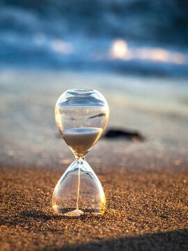 Hourglass on the sand of Tavernes de Valldigna beach (Valencia-Spain)