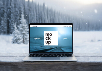 Laptop in winter scene mockup