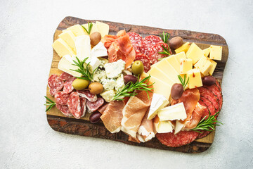 Antipasto platter with jamon, salami and cheese assortment.