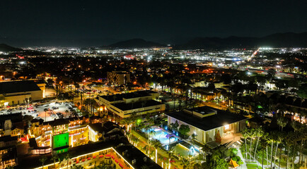 The Night Lights of Downtown Riverside, California from  a UAV Drone Aerial view with the horizon in the background during the Christmas Holiday Season.
