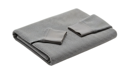 Folded gray textured towel with washcloths isolated on a dark background