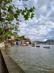 Fototapeta premium San Sebastian, Spain. Tourists ferrys to Santa Clara island in the bay of La Concha. Aitona Julian vessel