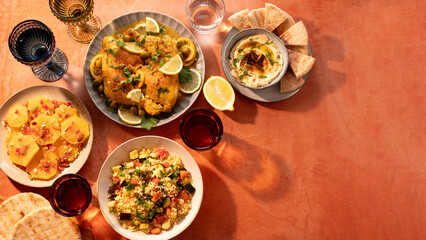 oroccan cuisine border with chicken tagine, vegetable couscous, orange salad