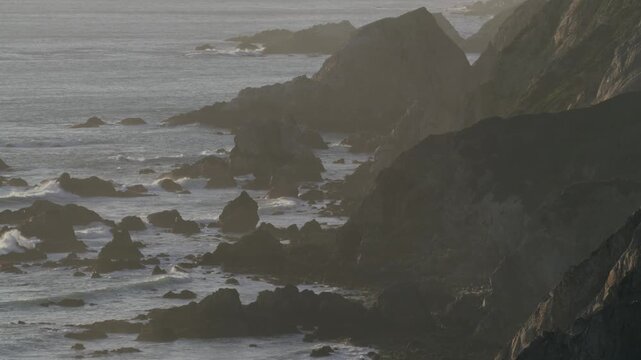 Waves Crashing on the Rugged Cliffs of the California Coast