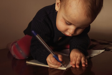 A child showing serious concentration while learning new skills