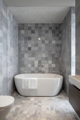 Modern bathroom with gray stone tiles and a bathtub in a spacious area featuring clean lines and minimal decor designed for relaxation and comfort