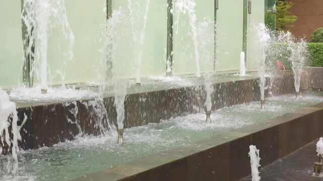 Calm flowing water with soothing tones, relaxing fountain sounds with gentle ripples and calming motions, tranquil water jets producing harmonious sounds for relaxation and peaceful meditation