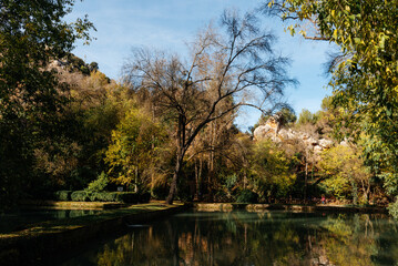 Monasterio de Piedra park water reflecting autumn trees