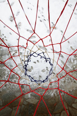 Basketball Hoop Net From Above Over Snowy Stone Pavement