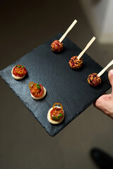 Gourmet Appetizers on a Black Serving Tray