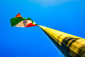 Waving flag of India on flagpole.