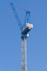 Tower cranes high in sky at construction site