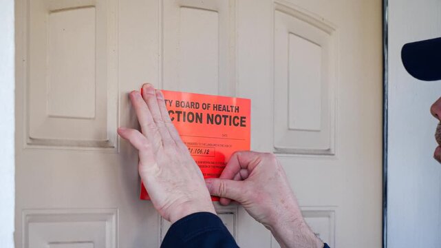 Man posts eviction notice on the front door of a condemned home