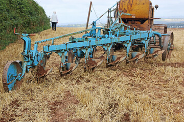 	
Vintage tractor ploughing a field	