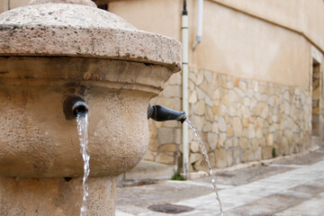 Detail of fountain pipes spouting water