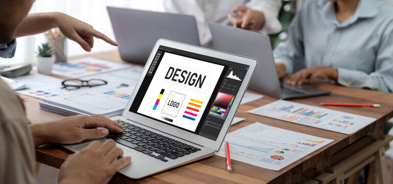 Graphic designer software for modern design of web page and commercial brisk ads showing on the computer screen - Powered by Adobe