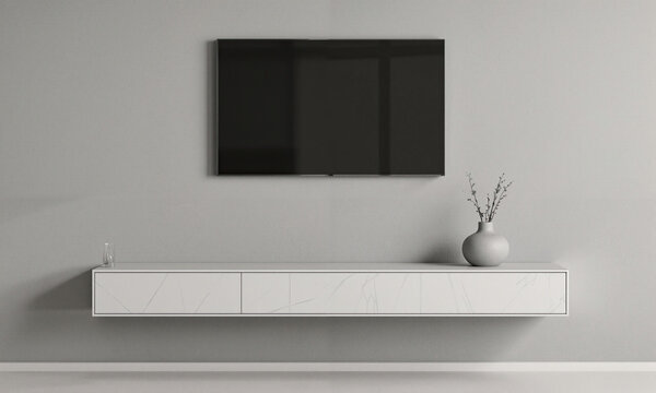 Grey Minimal Setup - Pale grey-painted wall hosting mounted TV above slim floating console styled with one vase; frontal centered
