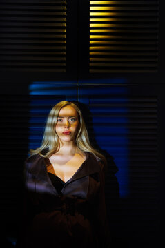 Atmospheric portrait of a woman in dramatic lighting