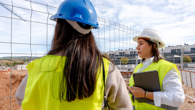 Architect and engineer collaborating on site development